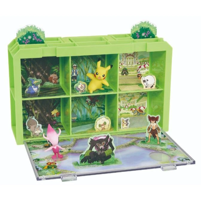 Pokémon diorama playset with Pikachu and other characters in a green shelf-like display.
