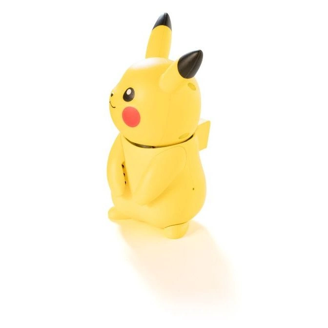  Yellow Pikachu toy with black-tipped ears and red cheeks, standing on a white surface.