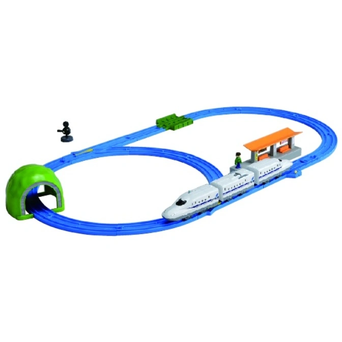 Toy train set with a bullet train on a blue track, including a tunnel, station, and figure.