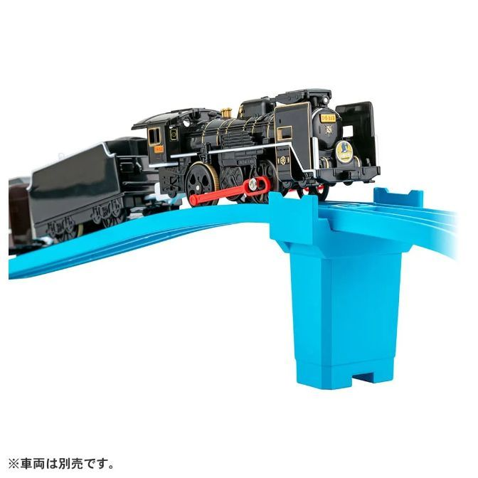  A toy train is on a blue track.