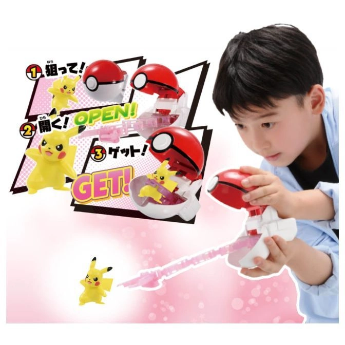  Boy plays with a Pokémon toy that launches a Pikachu figure from a Poké Ball.