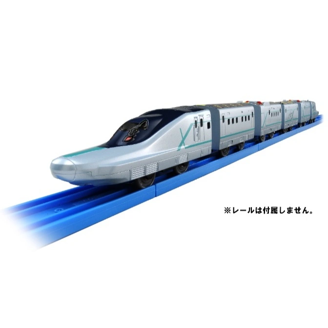  Silver toy bullet train with green accents on a blue track.