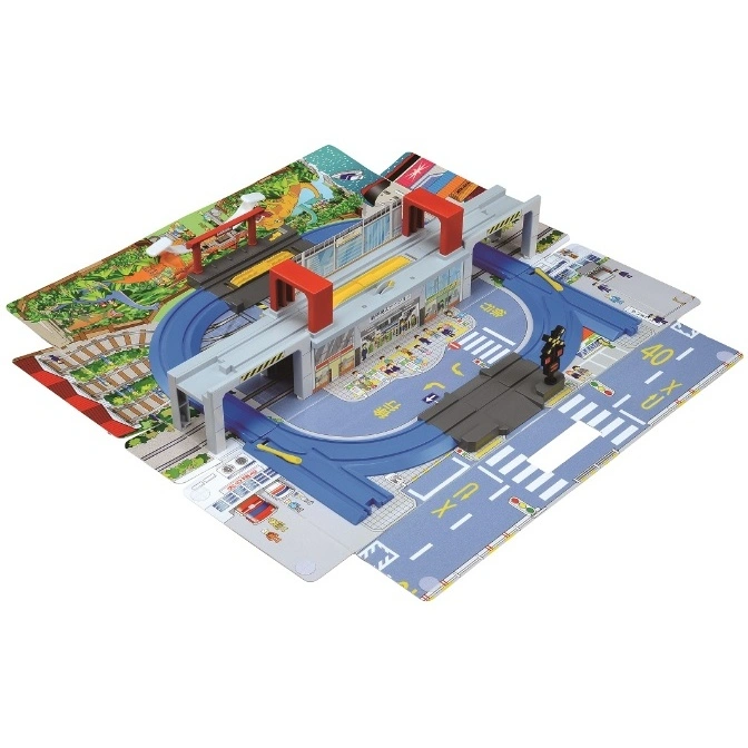 Toy train set with station, tracks, and city backdrop. Features a train station, roads, and a dinosaur park scene.